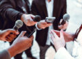 Female Leading Interview With Journalists Outside