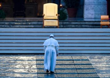 Pope Francis walks towards the platform to preside over a moment of prayer on the sagrato of St Peters Basilica, the platform at the top of the steps immediately in front of the façade of the Church, to be concluded with the Pope giving the Urbi et orbi Blessing, on March 27, 2020 at the Vatican. (Photo by Vincenzo PINTO / AFP) (Photo by VINCENZO PINTO/AFP via Getty Images)