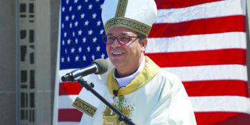 Bishop Rojas speaks during the Memorial Day Field Mass at St. Mary Cemetery in Evergreen Park on Memorial Day.  (Julie Jaidinger / Chicago Catholic)