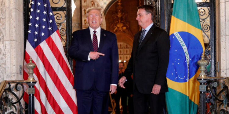 U.S. President Donald Trump hosts a photo-op with Brazilian President Jair Bolsonaro before attending a working dinner at the Mar-a-Lago resort in Palm Beach, Florida, U.S., March 7, 2020. REUTERS/Tom Brenner     TPX IMAGES OF THE DAY