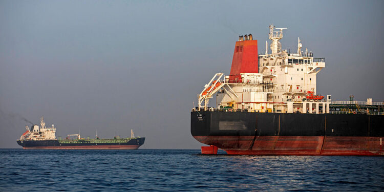 Ships anchored in the Strait of Hormuz near Larak Island, Iran. Photographer: Majid Saeedi/Getty Images Europe